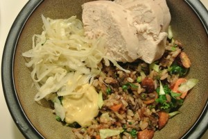 Whole roasted chicken, warm wild rice salad with roasted almonds and tamari sauce, homemade sauerkraut and dijon mustard.